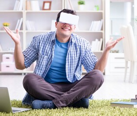 Freelance student with virtual reality glasses at home