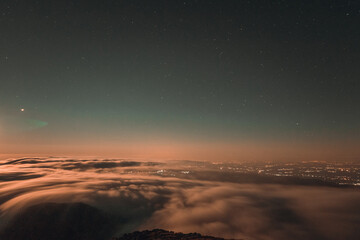 Moonrise, comet and stars landscape above the mountain in autumn season