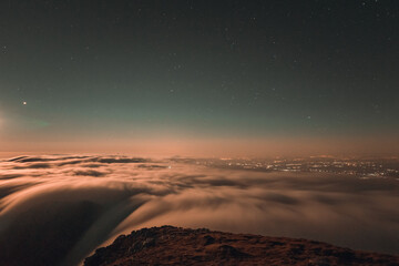 Moonrise, comet and stars landscape above the mountain in autumn season