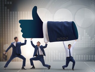 The businessmen supporting thumbs up gesture