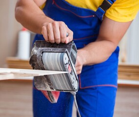 The carpenter working in the workshop
