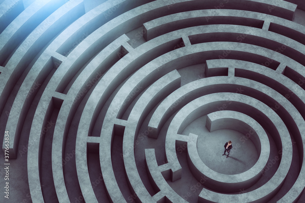 Wall mural confused businessman thinks how to find the right way to exit from a big maze