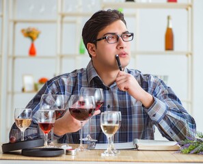 The professional sommelier tasting red wine