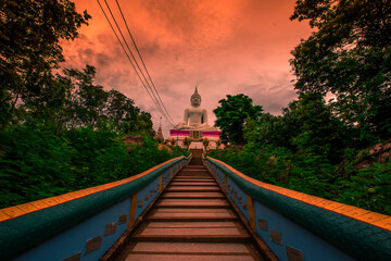 The background of a bridge or a walkway to admire the mountain scenery resembles a Phaya Naga mortgage statue, (Wat Phra Bat Phu Pan Kham) in Khon Kaen Province, Thailand.