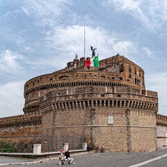 Rome, Italy: street artists in front of Saint Angel castle  under impressive sky