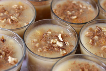 Traditional Turkish dessert Asure with walnuts. (Noah's Pudding). Close up.