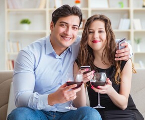 Young pair drinking wine in romantic concept