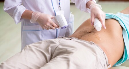 Young man visiting radiologyst for ultrasound procedure