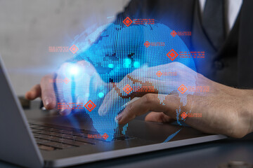 Fototapeta premium Businessman search for new opportunities, in international business, typing laptop background. World map hologram.