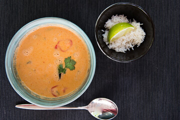 Soup, liquid dish close-up. Bright orange color.