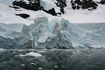 The beautiful Paradise Bay.Mammoth glaciers spear out of the ocean-blue sea, icebergs that have run...