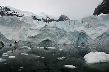 The beautiful Paradise Bay.Mammoth glaciers spear out of the ocean-blue sea, icebergs that have run...