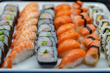 Assorted sushi and rolls displayed on the buffet 