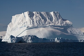 Large floating mass of ice detached from a glacier or ice sheet and carried out to the sea. Antarctic peninsula.South ocean.Antarctica.