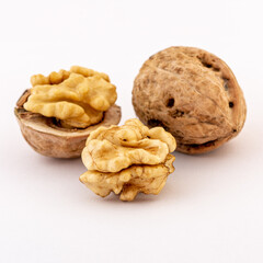 ripe walnuts on white background