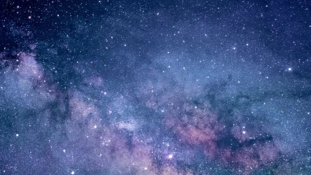 Camera flying through the clouds and star field in outer space.