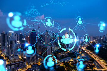 Glowing Social media icons on night panoramic city view of Kuala Lumpur, Malaysia, Asia. The concept of networking and connections between people and businesses in KL. Double exposure.