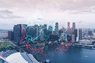 World planet Earth map hologram over panorama city view of Singapore, Asia. The concept of international connections and business. Multi Exposure.