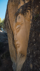 Faces carved in stone on the Route of Faces