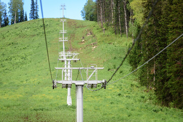 Lift with iron poles and cables for lifting people on the mountain.