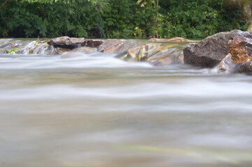 water flows through the rocks, at a long exposure