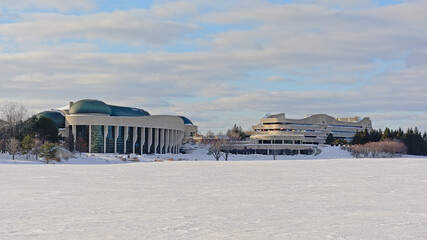 National history museum and surroundings along frozen Ottwa river covered with snow on a sunny cold...