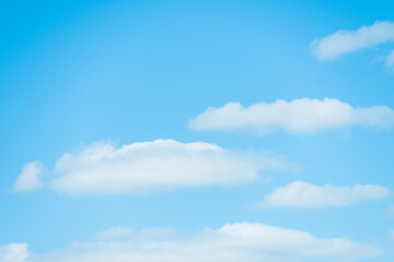 Blue sky with floating white clouds. The background.