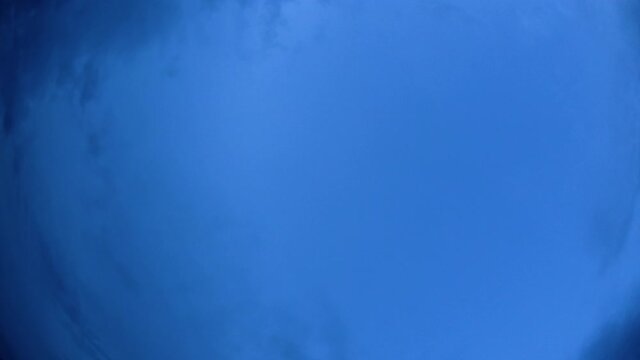Blue sky and layer of clouds moving about in a fine sunny afternoon; time-lapse of clouds with different forms and thickness moving from every direction was a fantastic thing to watch.