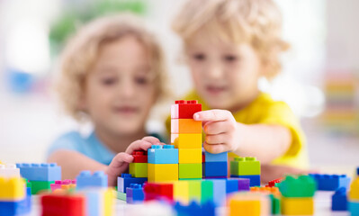 Child playing with toy blocks. Toys for kids. - obrazy, fototapety, plakaty