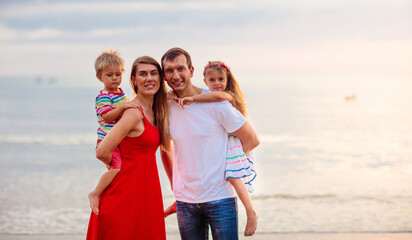 Fototapeta na wymiar Family with kids on tropical beach. Sea vacation.
