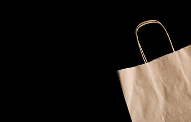 craft paper bag on black isolated background