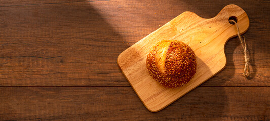 Fresh bread on wooden table for breakfast