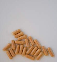 Isolated group of natural pills on a white background