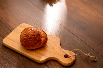 Fresh bread on wooden table for breakfast
