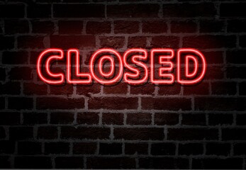 CLOSED  - red neon light entrance sign on brick wall