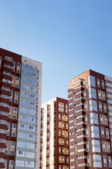Fototapeta premium Modern high-rise residential buildings against the blue sky. High resolution image. Copyspace.