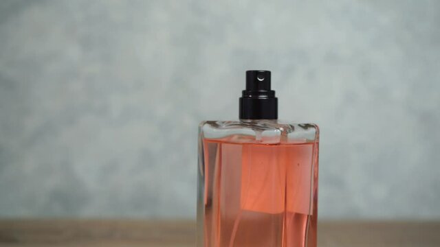 pink glass perfume bottle. the concept of self-care
