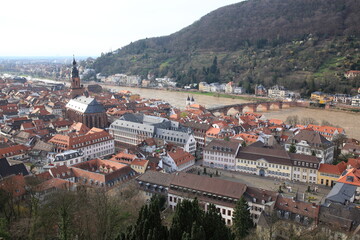 Aerial view of old town with Church of the Holy Spirit and Old Bridge over the river Neckar in spring seen from the balcony of Heidelberg Castle in Heidelberg, Germany