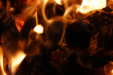 Hot flames of a fire, detail view of a campfire