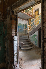 Interior with stairs of an old abandoned house