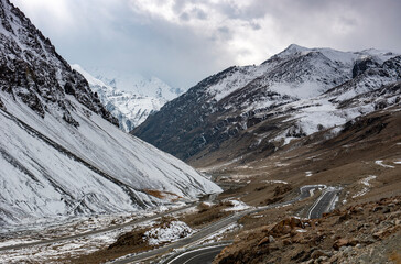 zigzag road in the snow mountains of khunjrab pass kkh, gojal, hunza, northern areas of Pakistan 
