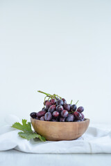 Fresh grapes in a wooden bowl