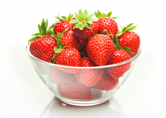 Fresh raw organic strawberries in glass bowl plate on white background.