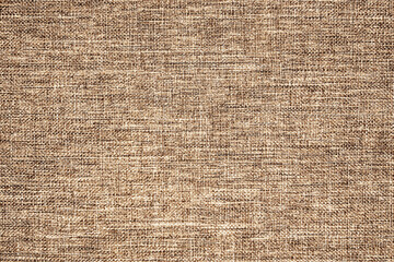 Natural brown linen fabric background. Fiber structure texture. Vintage canvas pattern.