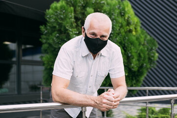 Senior man wears protective mask against infectious diseases and flu, health care concept. coronavirus quarantine.