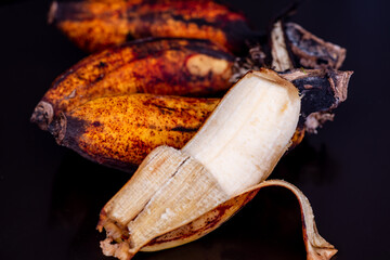 Ripe banana full of potassium in black background