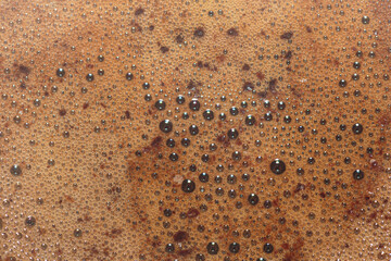 Natural foam of Turkish coffee closeup. Concept of art background.
