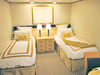 View into interior category or inside cabin or stateroom with two single beds on luxury cruiseship...