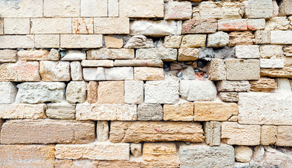 Stone tiles wall texture antique rock texture. Antic stone background texture. history construction archaeological exploration. Natural stone wall tiles texture. Old rock rustic textured stone pattern