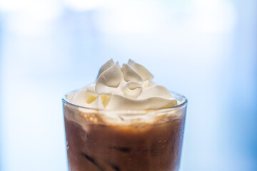Iced coffee with whipped cream and sprinkle with almonds